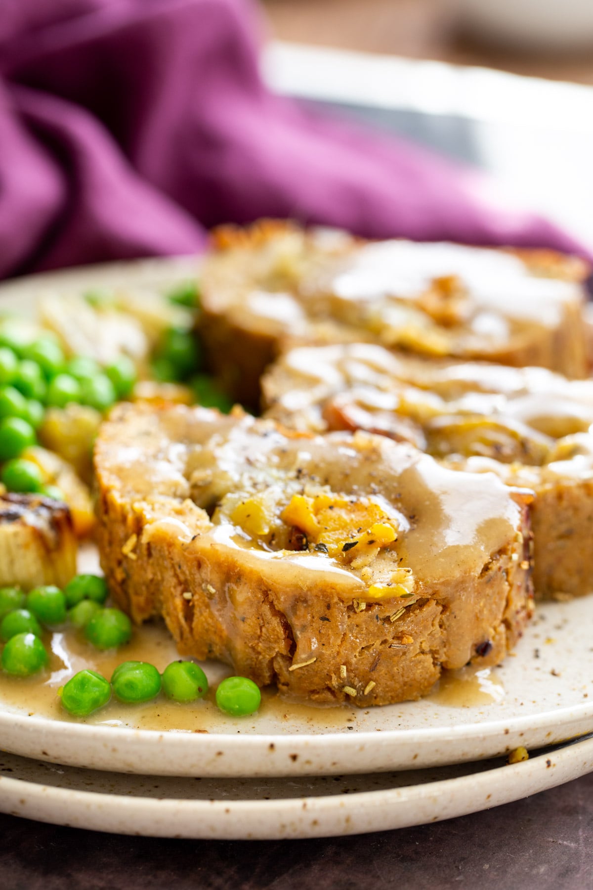 glutenfree nut roast three slices of vegan holiday nut roast filled with roasted vegetables