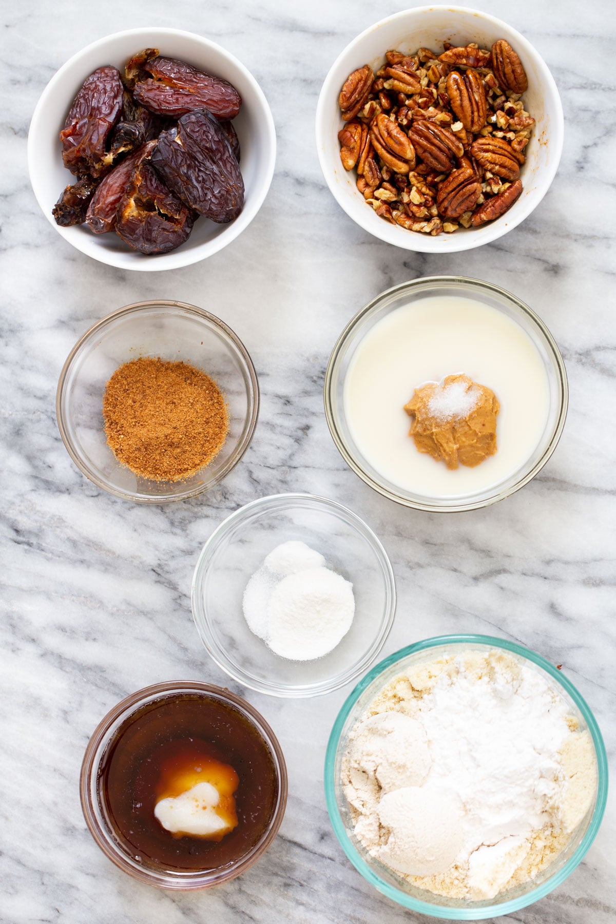 vegan pecan pie bars ingredients for vegan pecan pie bars on a marble counter