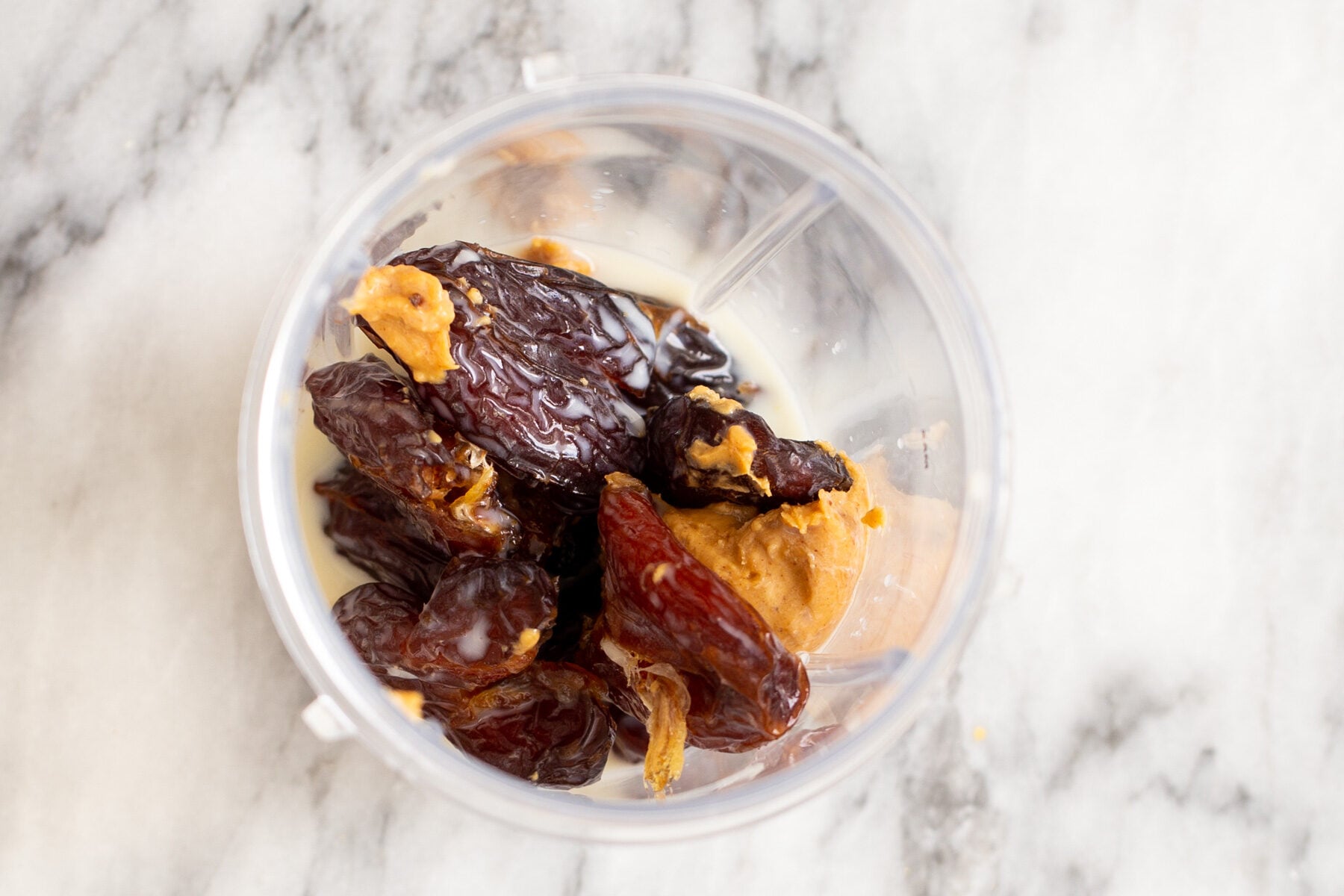 vegan pecan pie bars ingredients for date caramel in a blender
