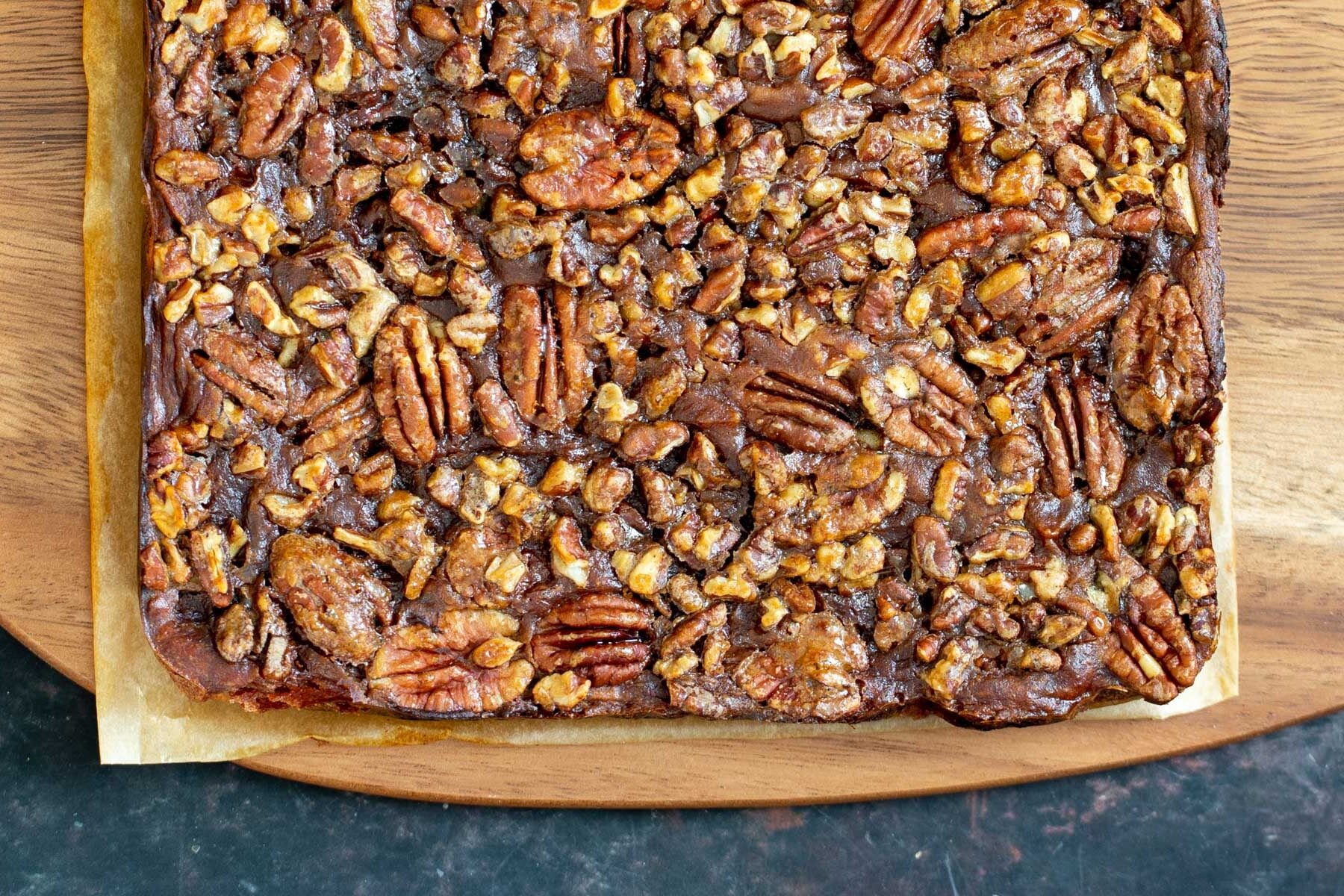 vegan pecan pie bars vegan pecan pie bars on a wooden chopping board