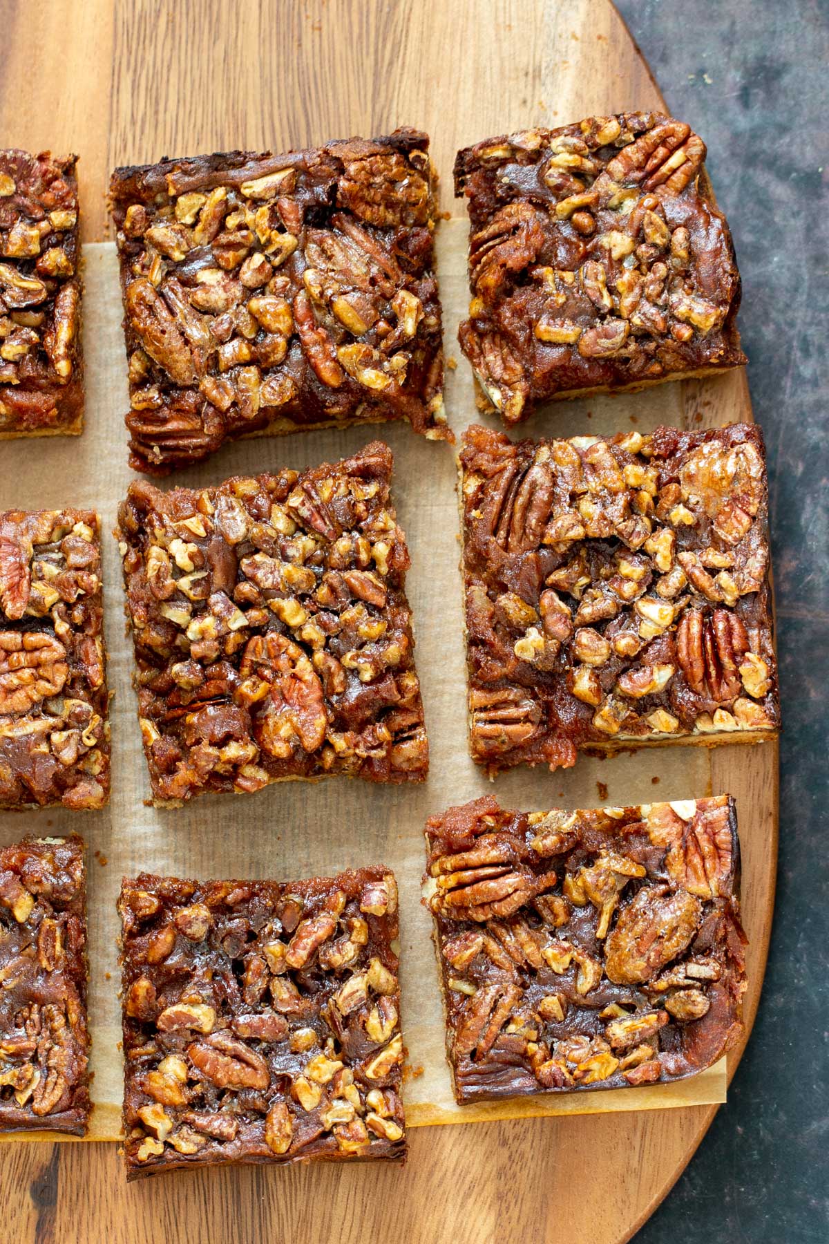 vegan pecan pie bars vegan pecan pie bars on a wooden board