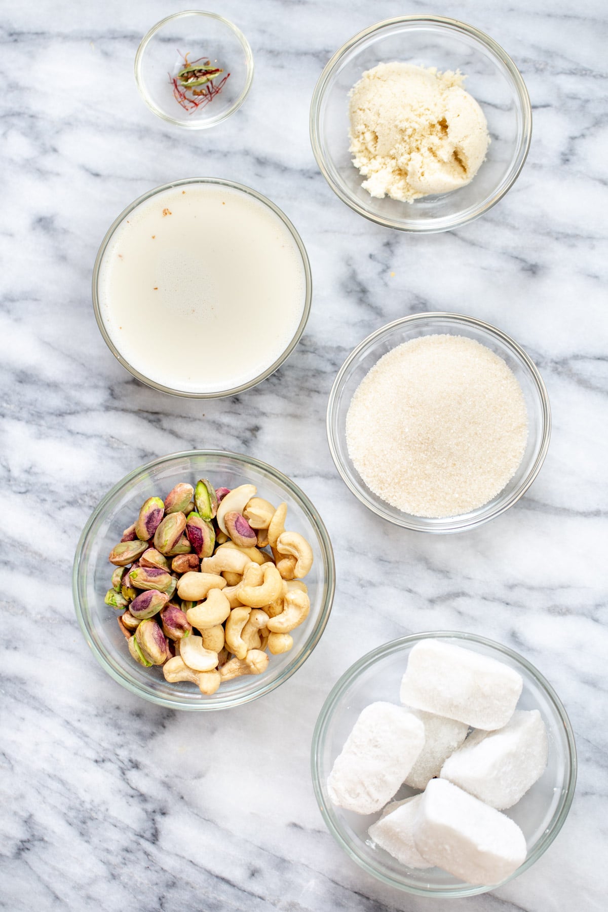 ingredients needed for making vegan rabri Ingredients for Indian milk pudding rabri in bowls