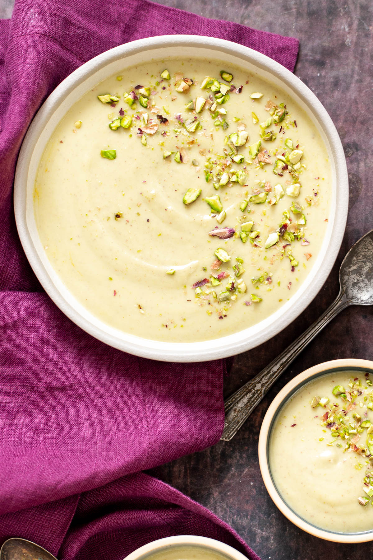 rabri recipe three bowls of Indian rabri pudding chopped with pistachio