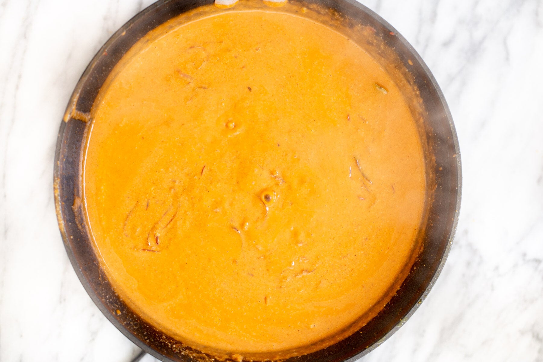 gravy for Indian Tofu Malai curry in a black skillet