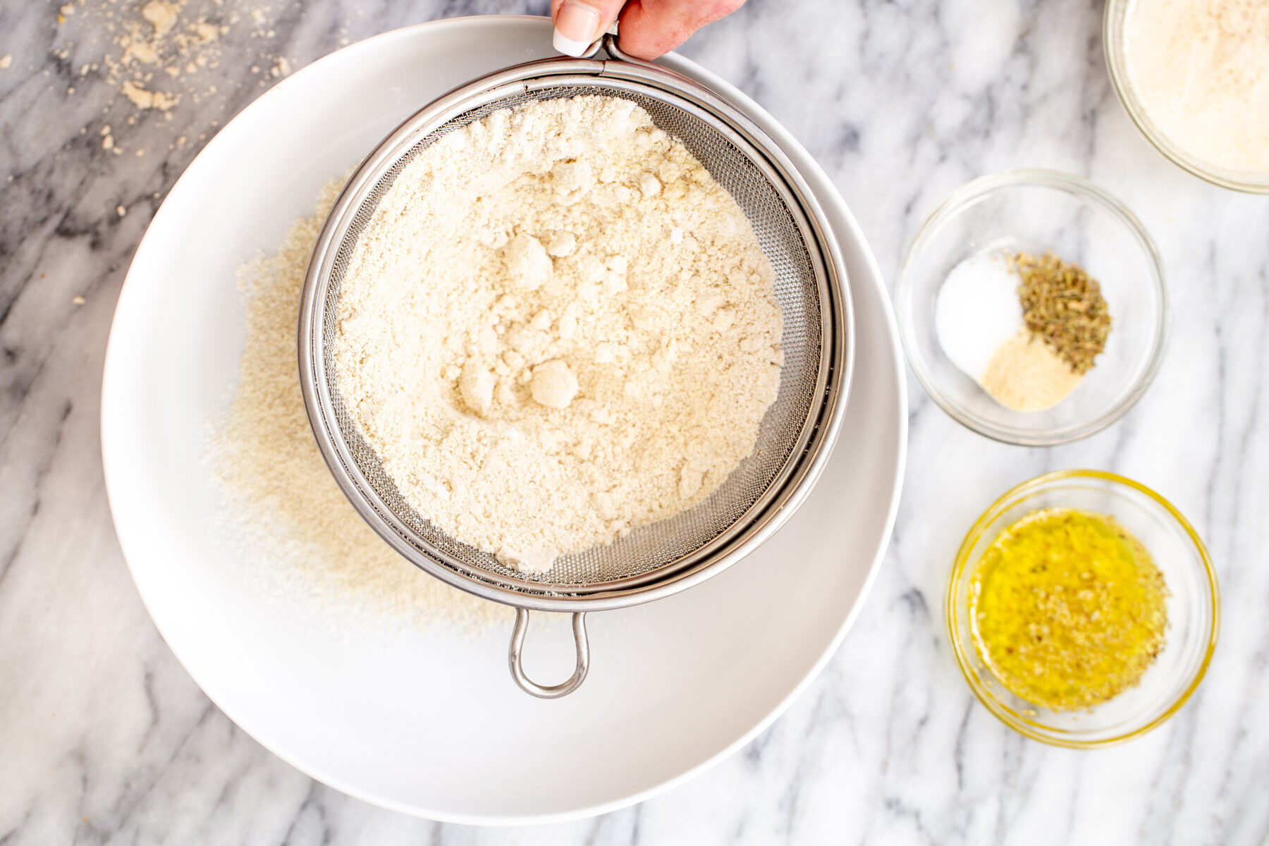 glutenfree focaccia dry bread ingredients being sifted into a bowl
