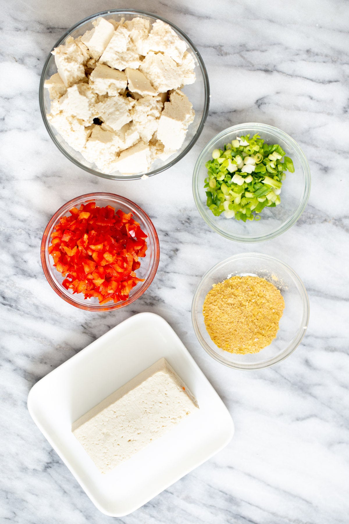 tofu scramble seasoning ingredients for vegan tofu scramble on a marble countertop