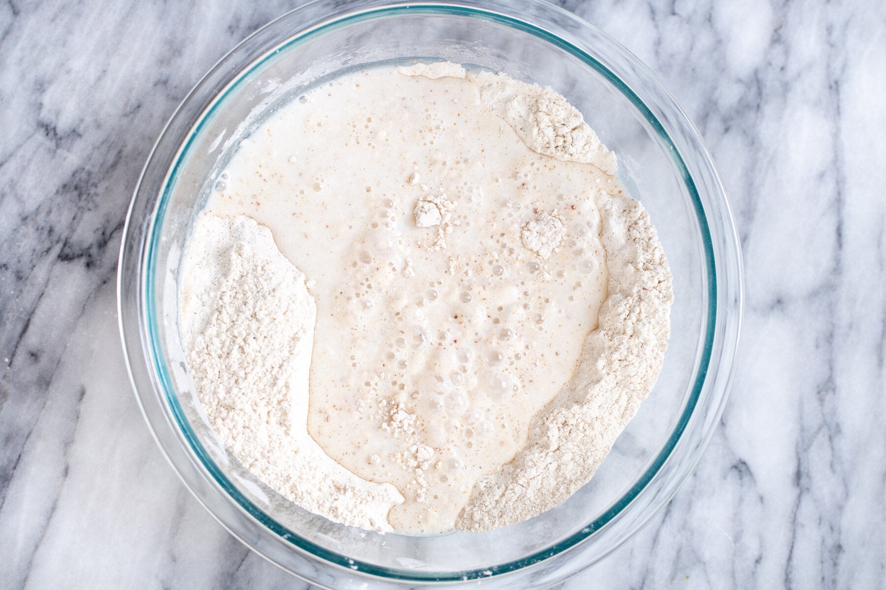vegan sheet pan pancakes wet and dry ingredients for vegan sheet pan pancakes in a glass bowl
