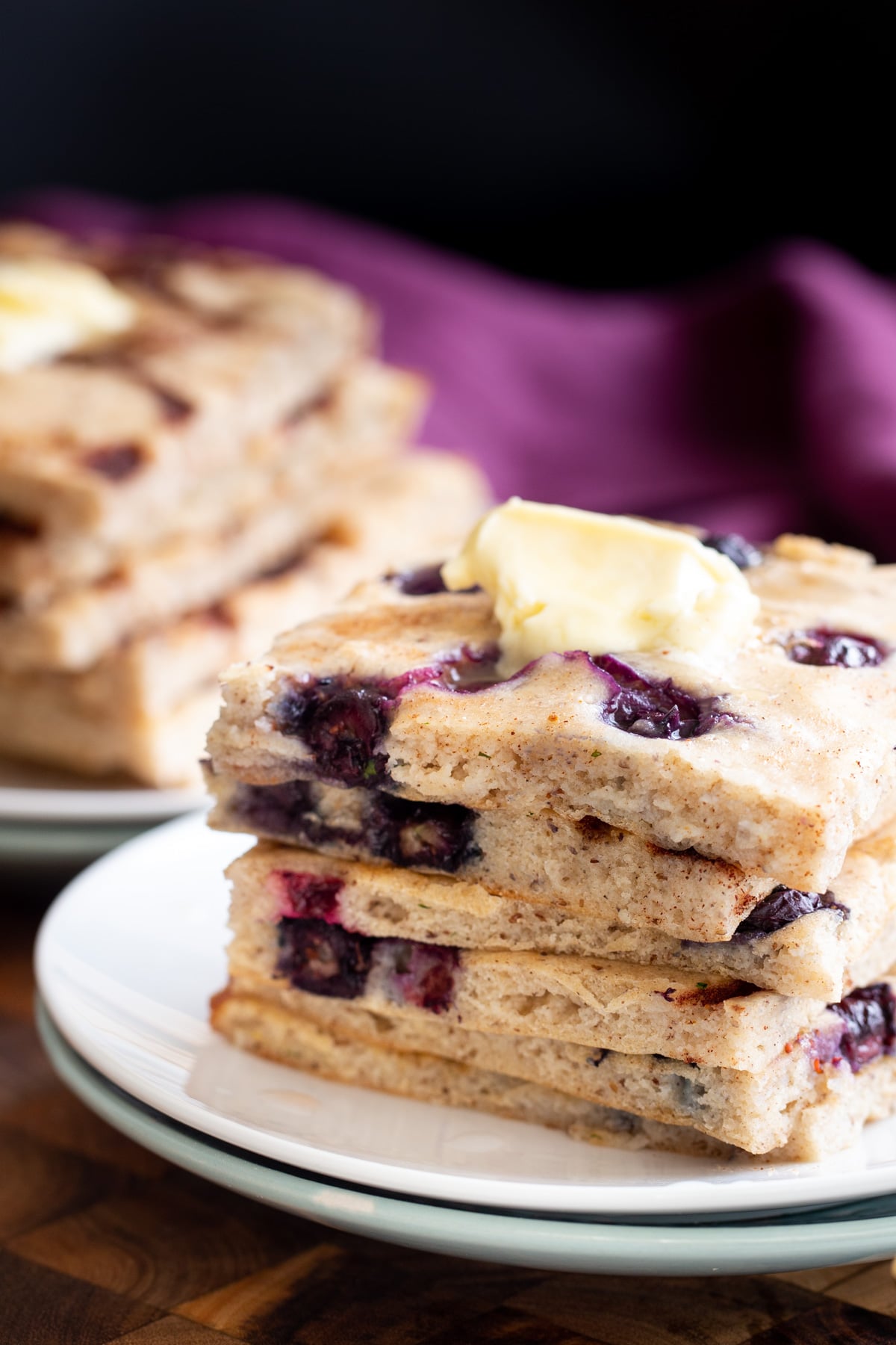 vegan sheet pan pancakes stacked vegan sheet pan pancakes topped with a dollop of vegan butter