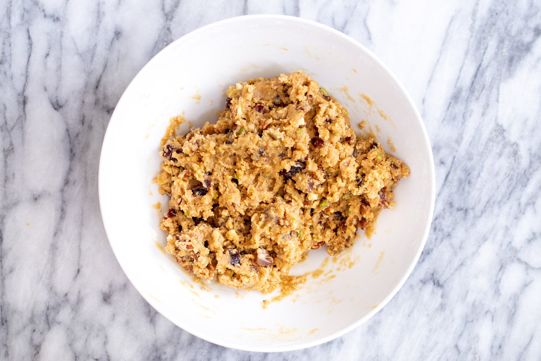date nut cookie mix date nut cookie dough in a white bowl