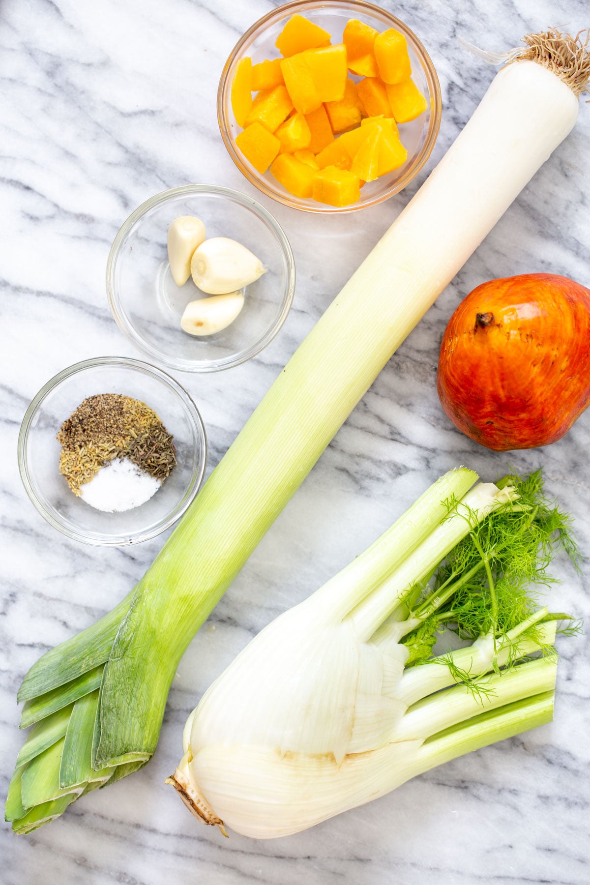 roasted golden beets ingredients for roasted vegetables on a marble countertop