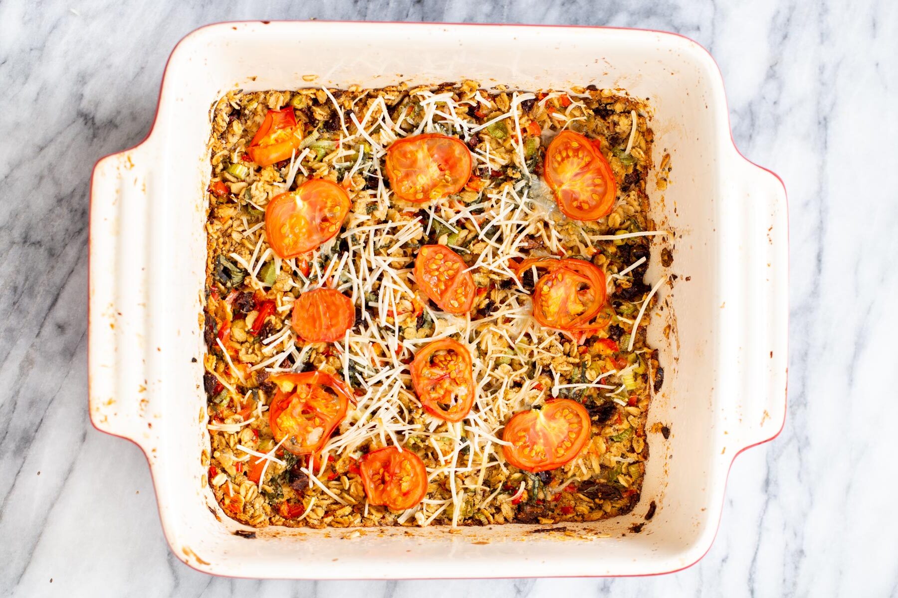 savory pizza oatmeal bake in a white casserole dish