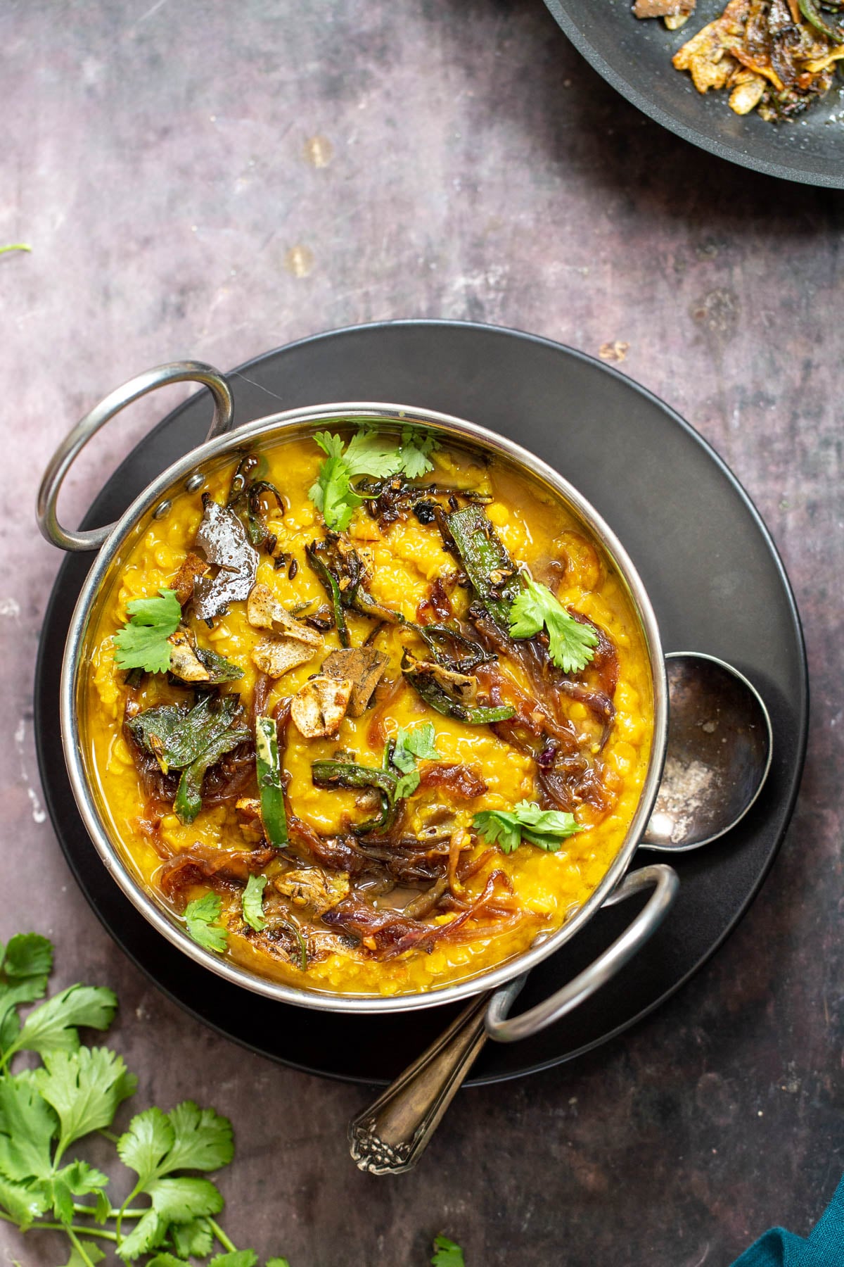 Restaurant-Style Masoor Dal Tadka in an Indian serving dish 