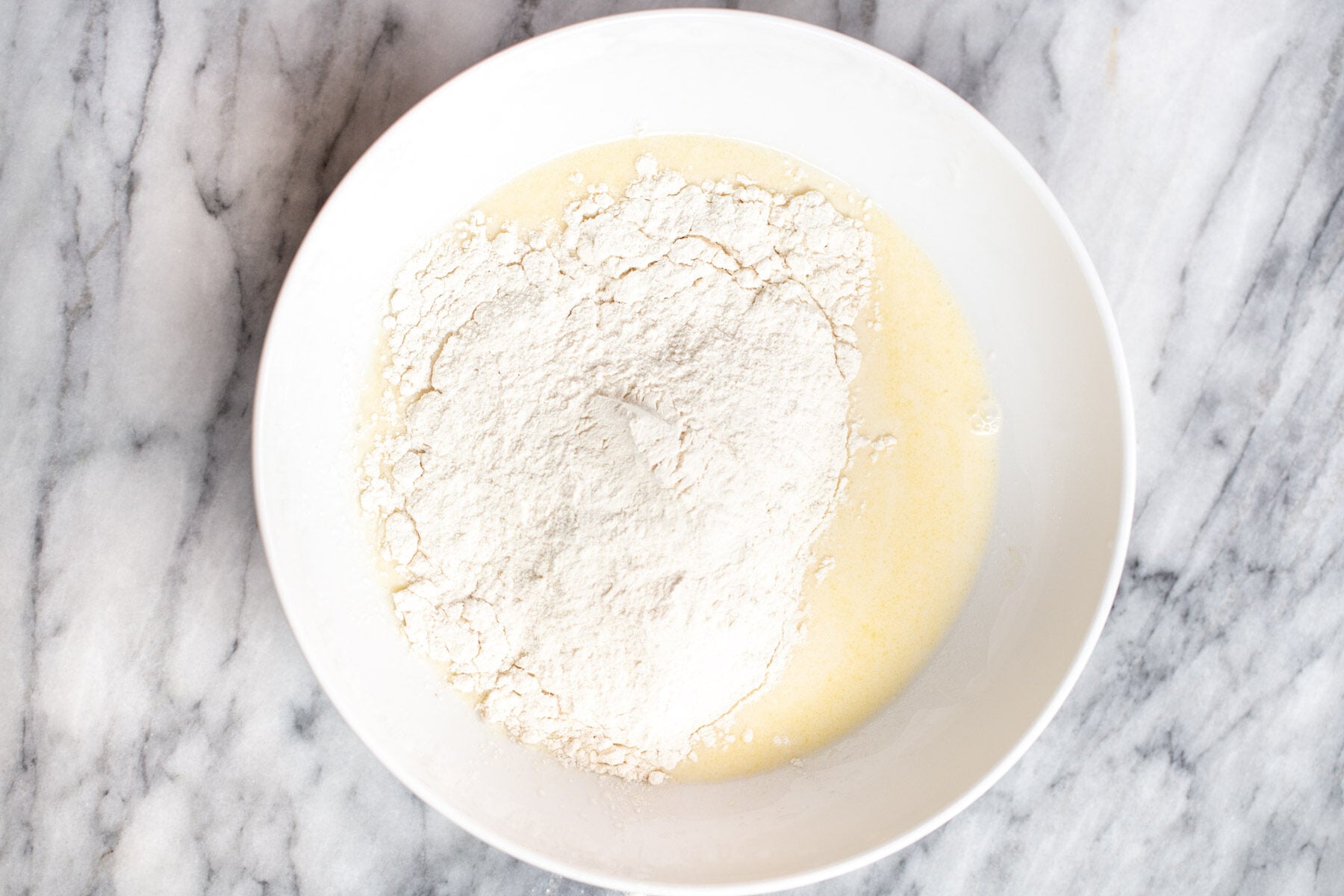 vegan naan bread ingredients in a bowl