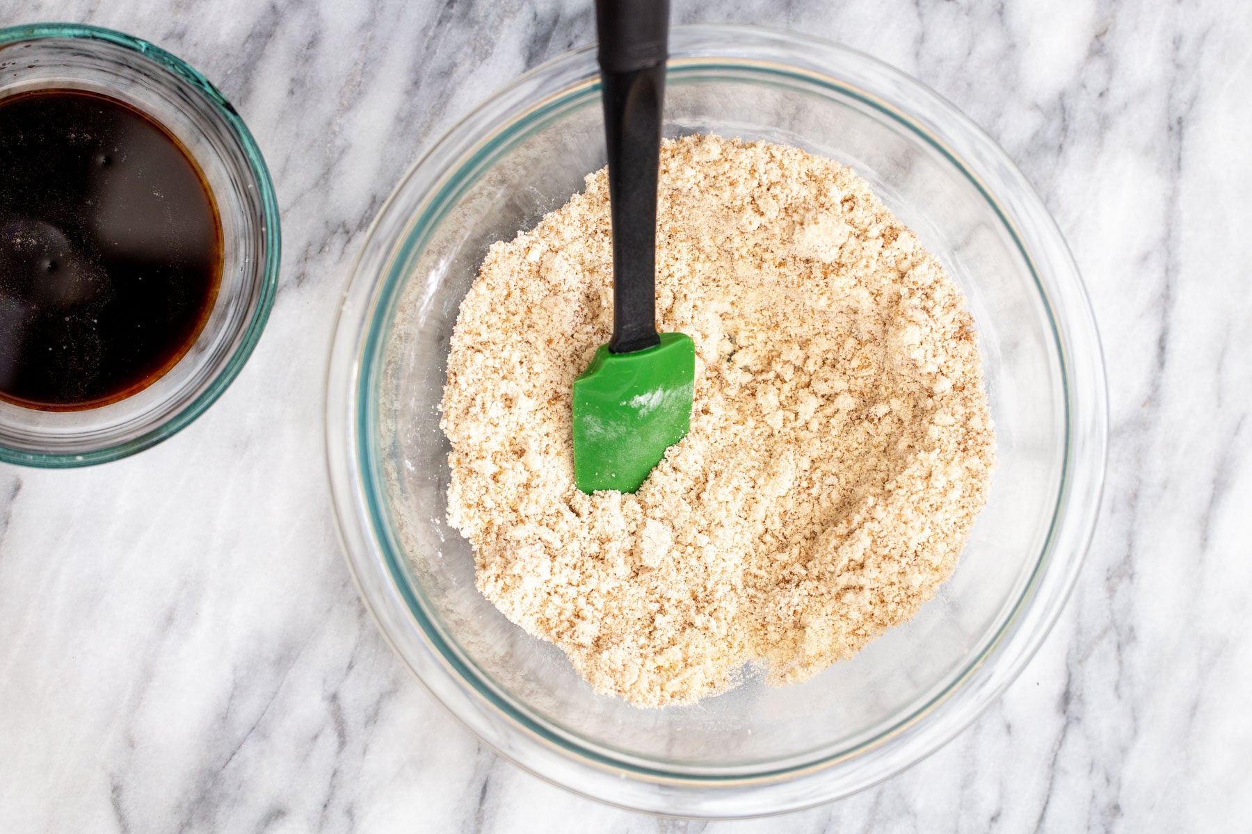 dry ingredients in a glass bowl on a marble countertop