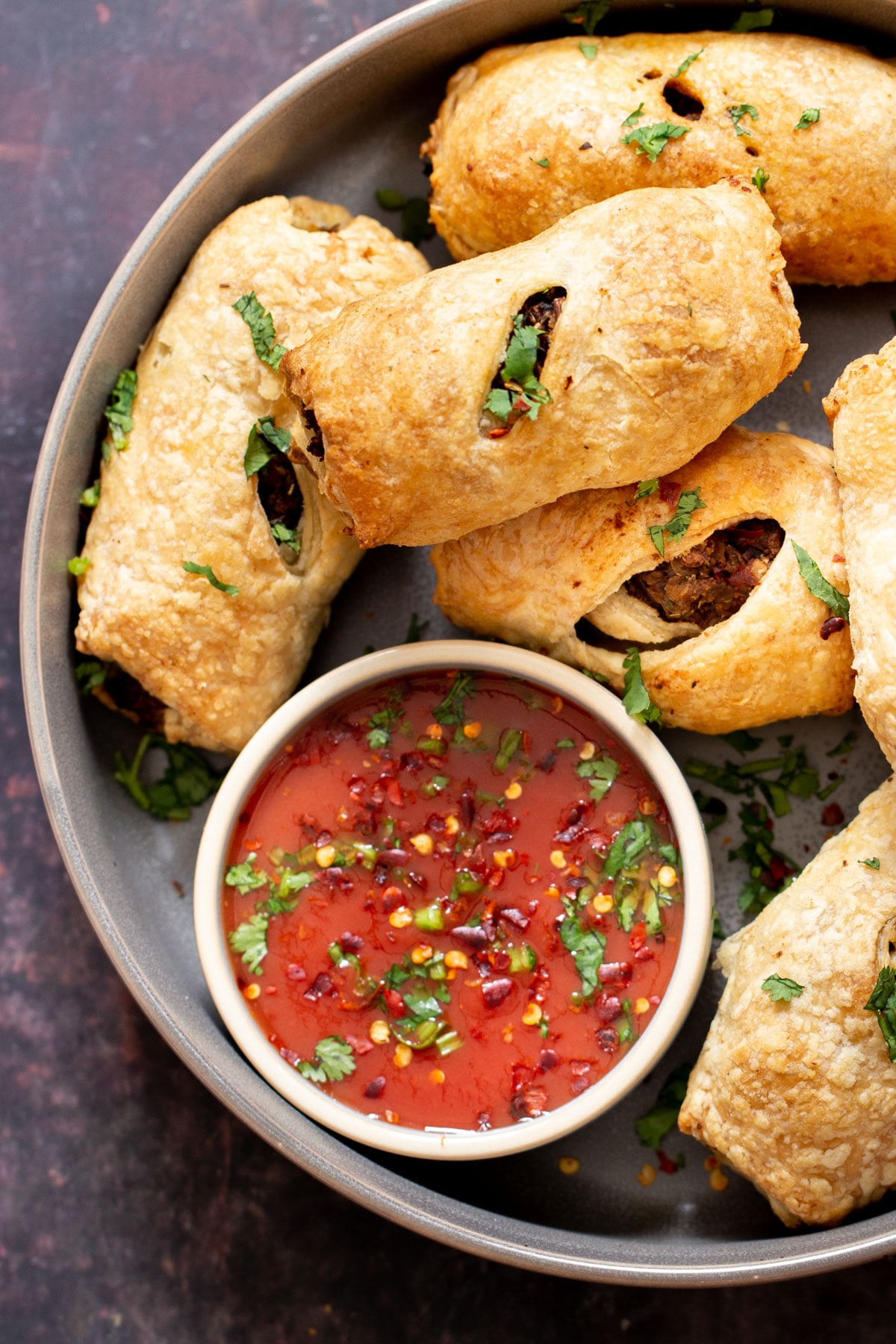 vegan sausage rolls vegan sausage rolls with a small dish of tomato sauce
