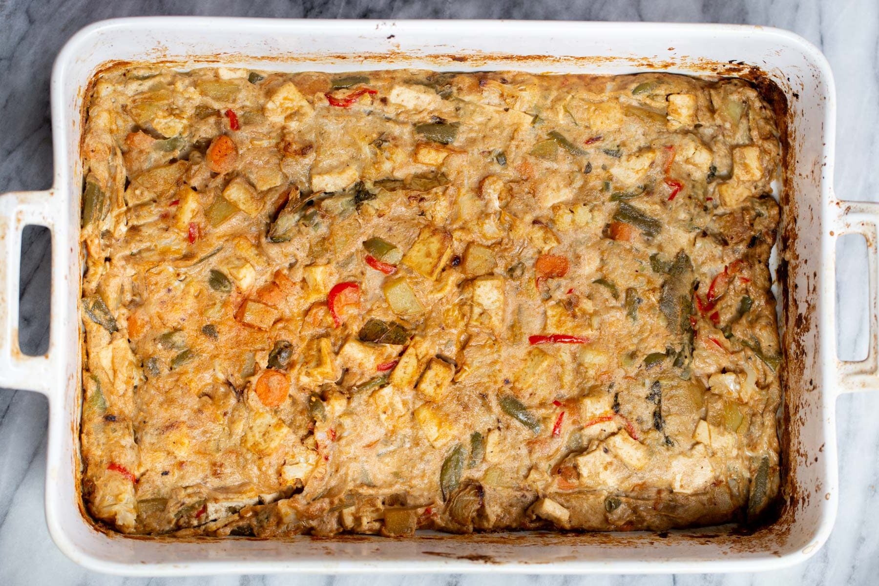 Navratan Korma Baked Vegan Navratan Korma in a white casserole dish