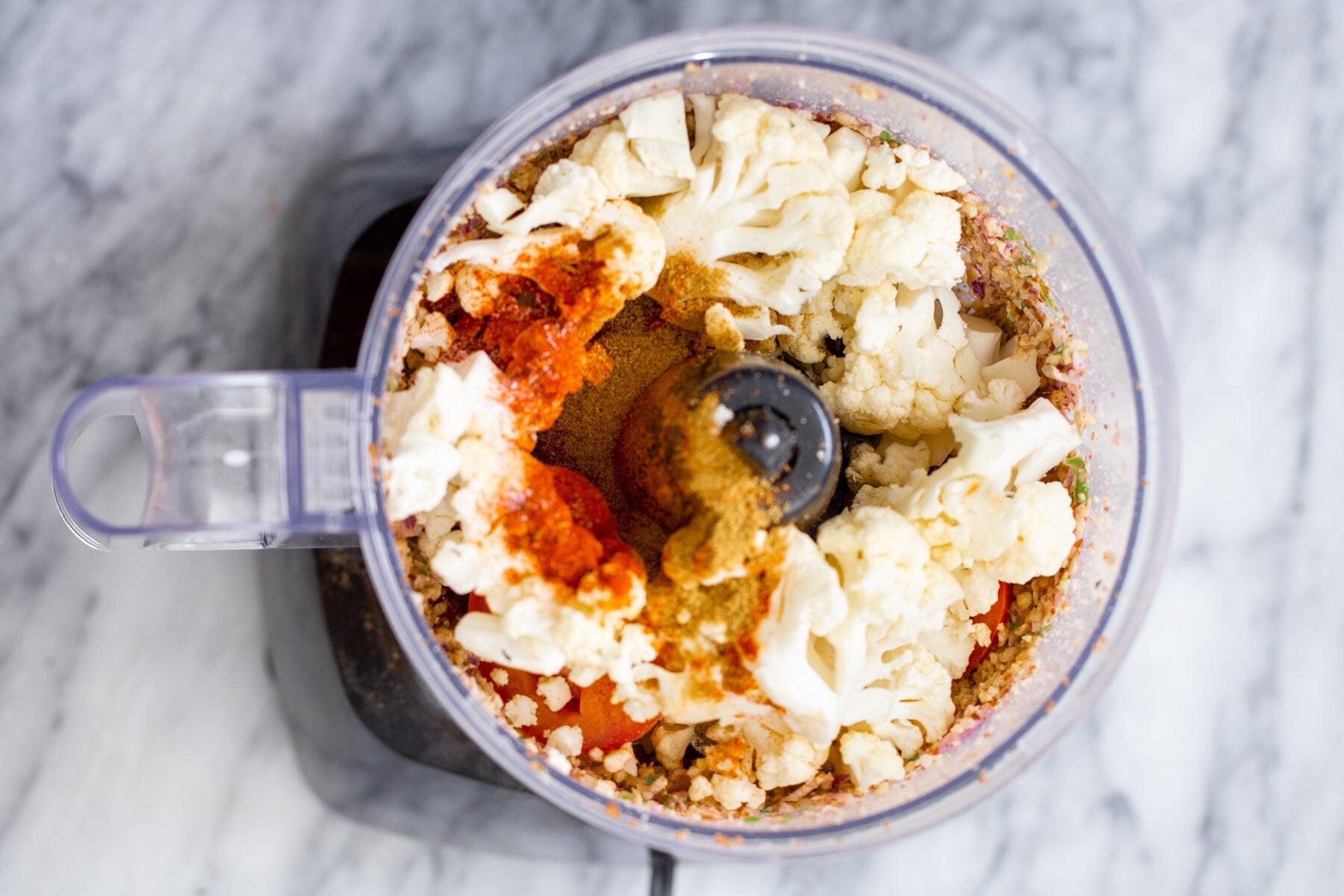 cauliflower and more taco meat ingredients in a small food processor