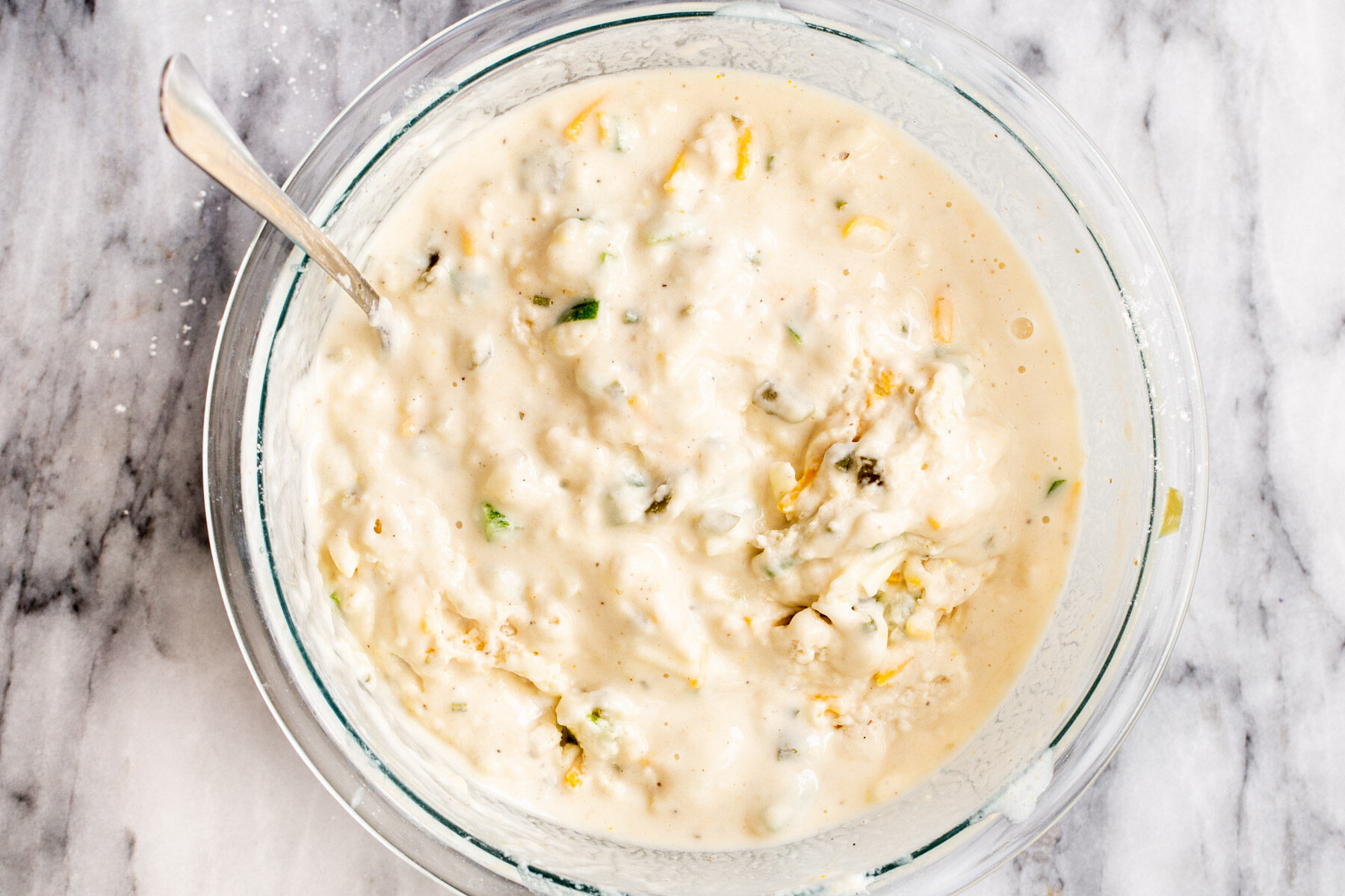 vegan jalapeno waffles batter in a glass bowl