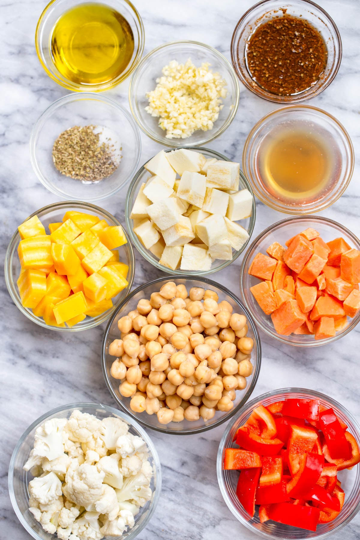 ingredients for roasted root vegetable bowls on a marble countertop
