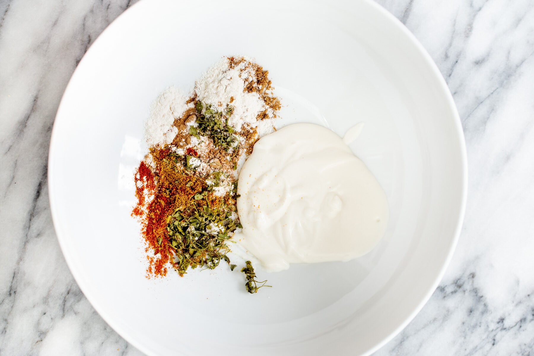 tofu tikka marinade ingredients in a white bowl