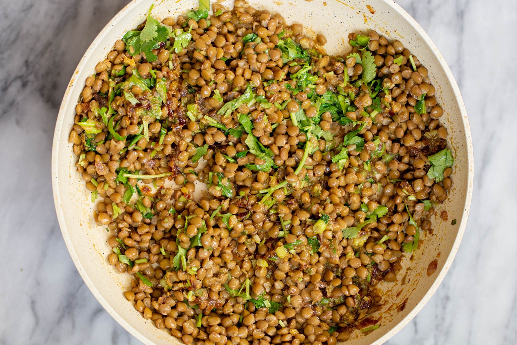 lentil filling for vegan sambusa pie in a white saucepan