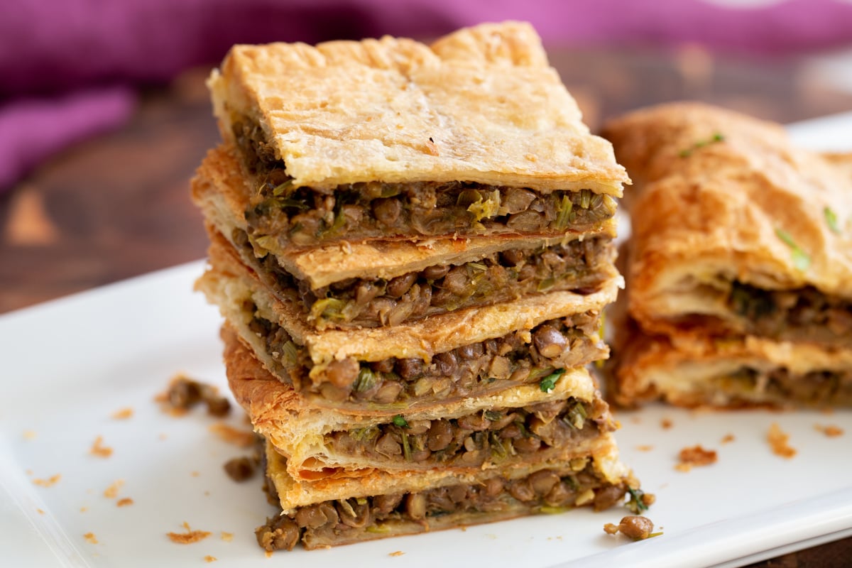 vegan sambusa pie stacked slices of vegan lentil pie with puff pastry