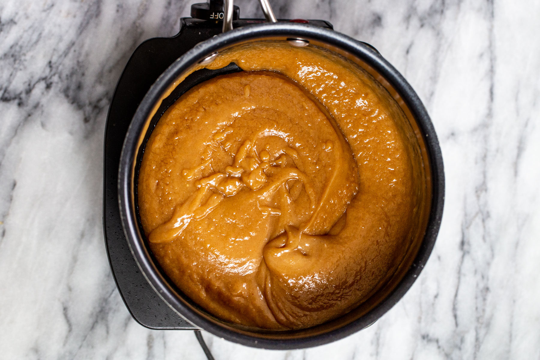 peanut butter filling for chocolate tarts in a saucepan
