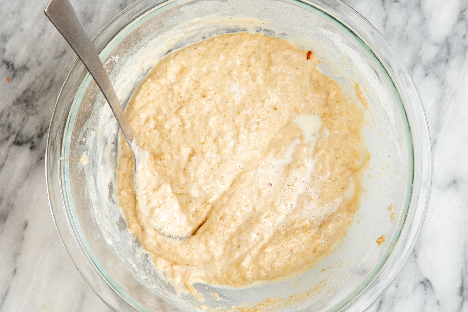 carrot cake batter in a glass bowl 