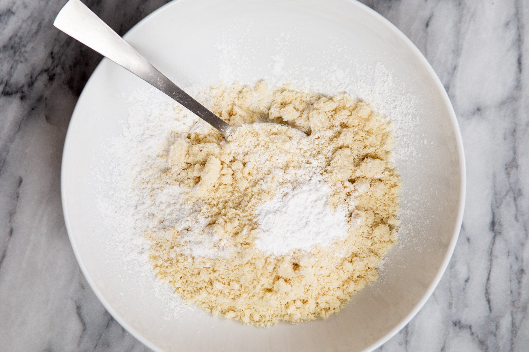 dry ingredients for almond flour pizza crust being mixed in a bowl