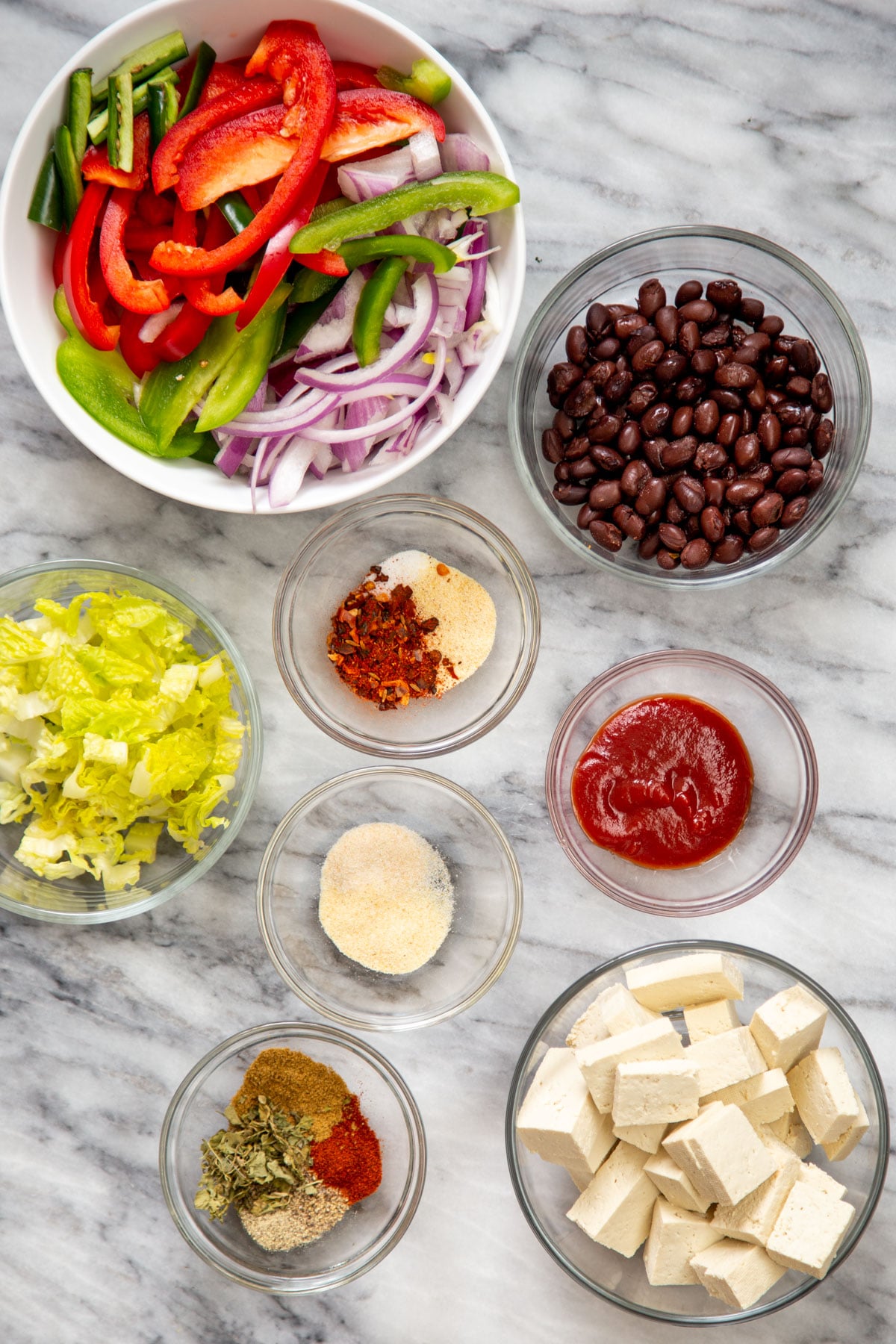 ingredients for tofu tacos on a marble countertop