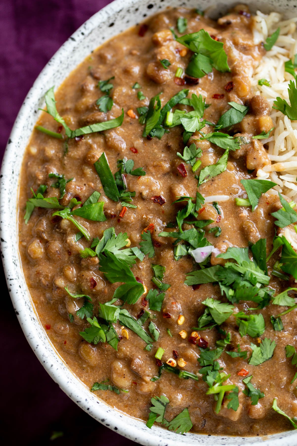 a serving of green mung bean dal served with rice 