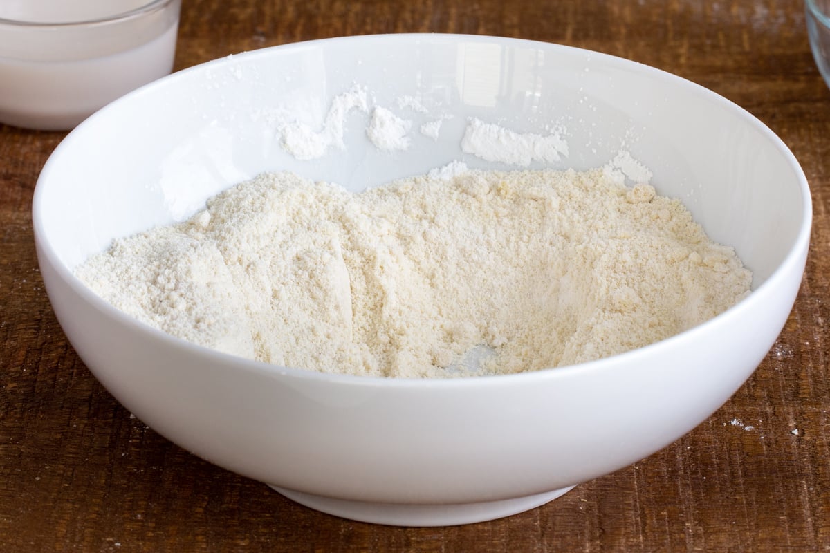 dry ingredients for vegan naan bread in a white bowl