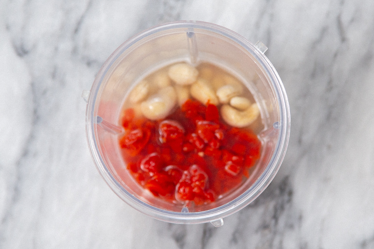 cashews and red bell peppers in a blender
