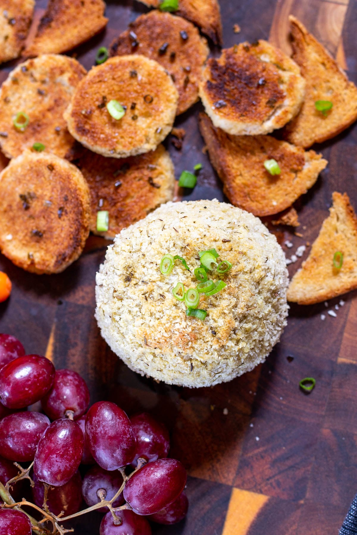 vegan stuffing flavored cheeseball with grapes and crackers