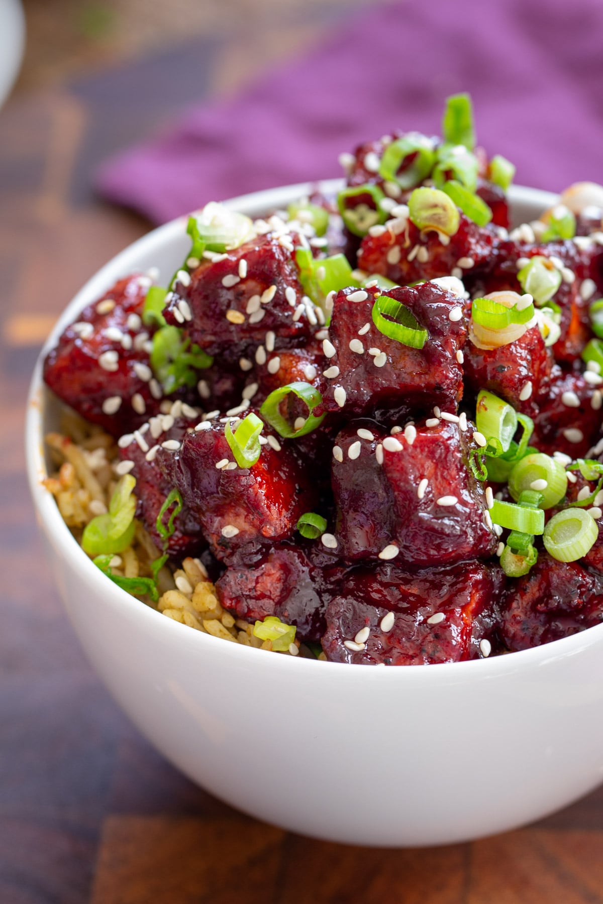 a bowl with blackberry gochujang served over rice