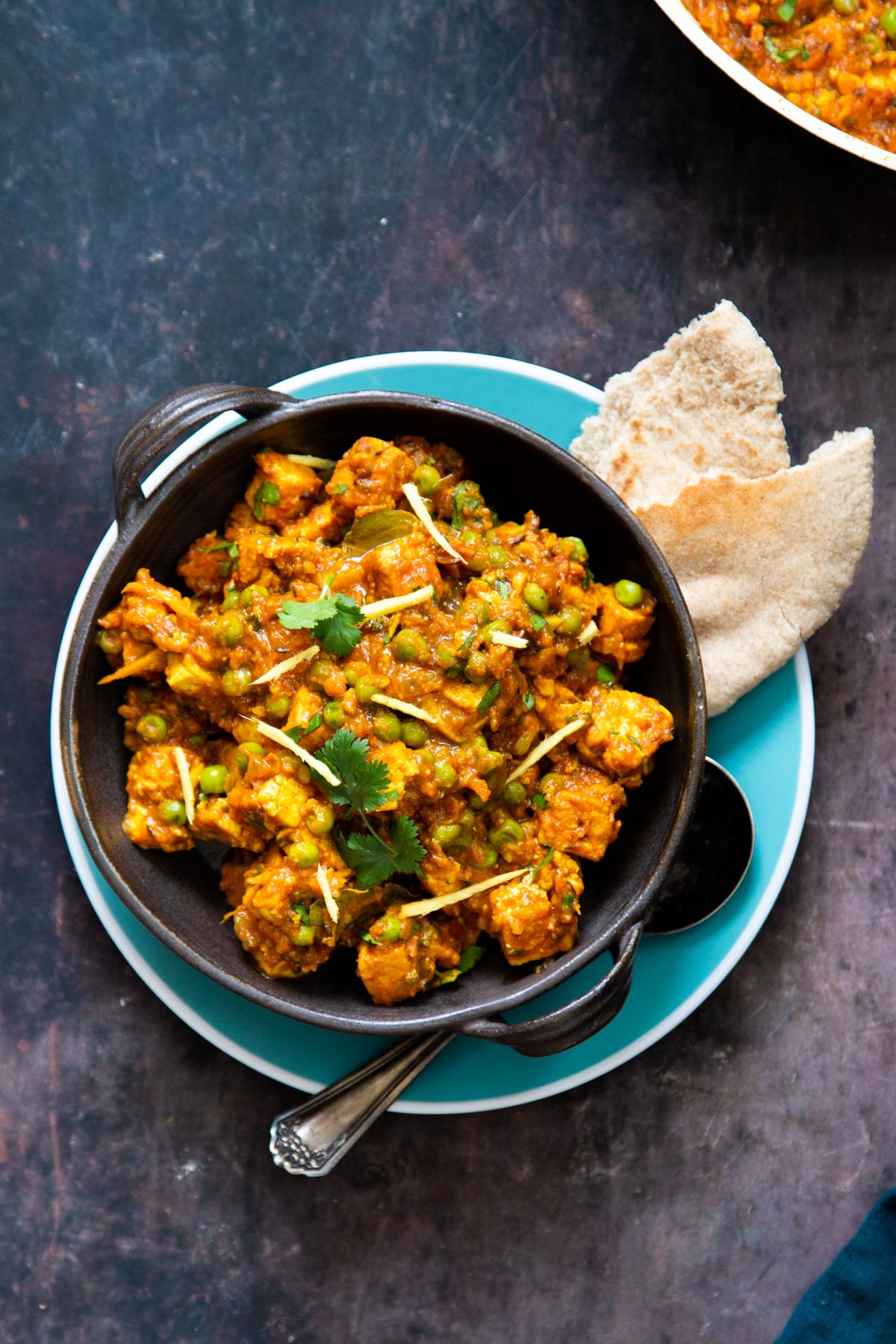 vegan matar tofu with peas served with a side of flatbread