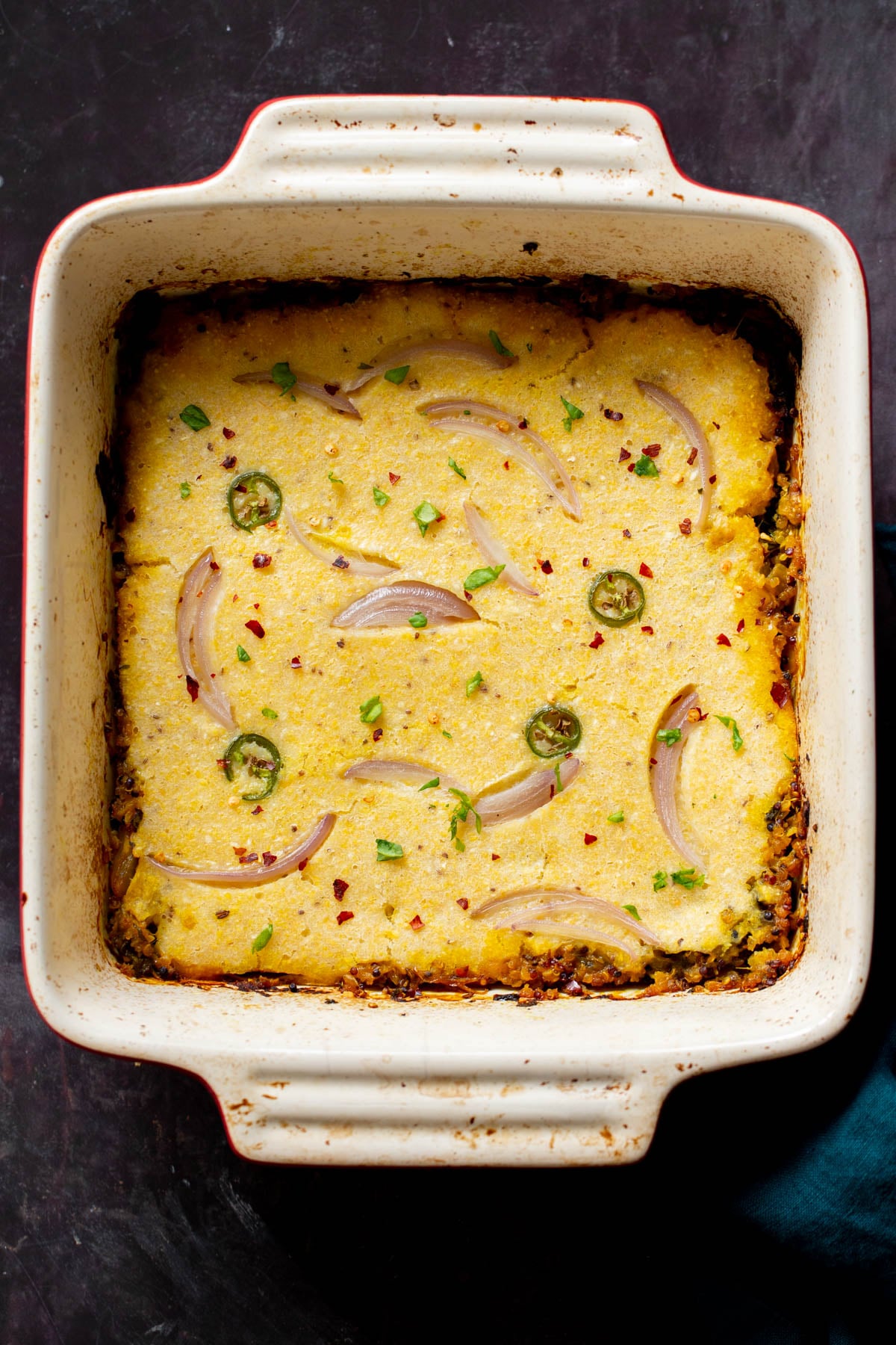 overhead shot of a casserole dish with vegan saag cornbread casserole