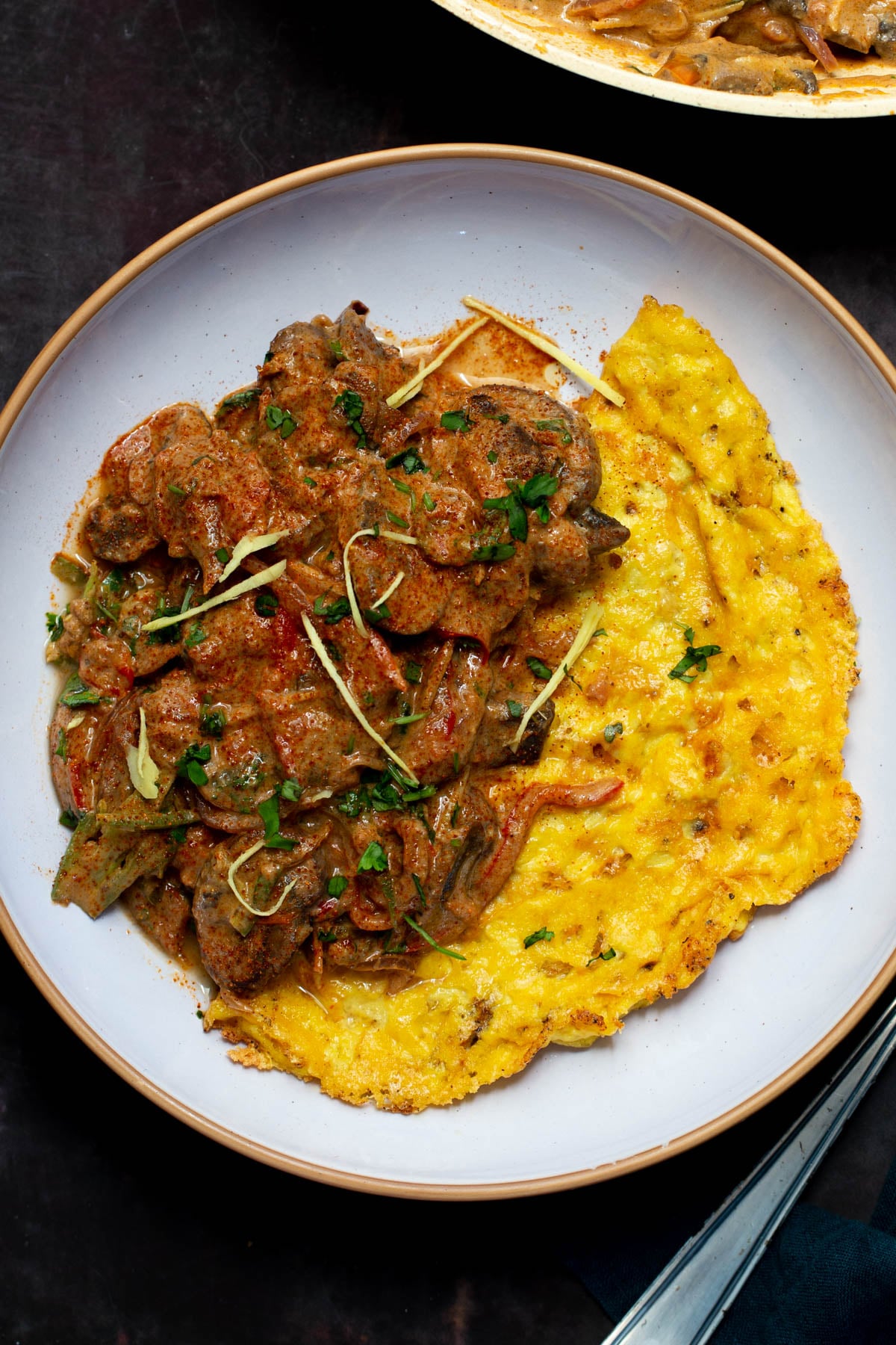 vegan mushroom patiala served alongside a vegan omelet