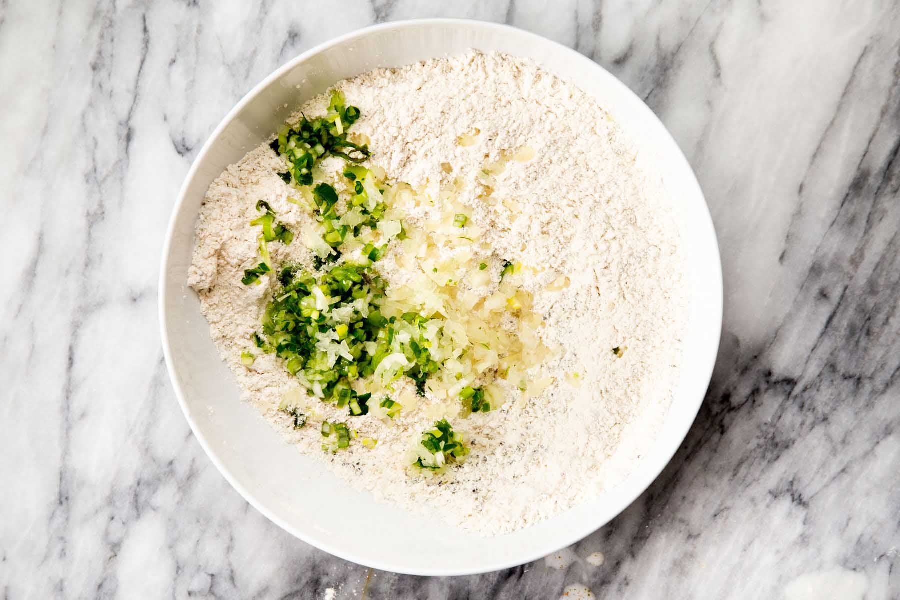 adding aromatics to flour and spices