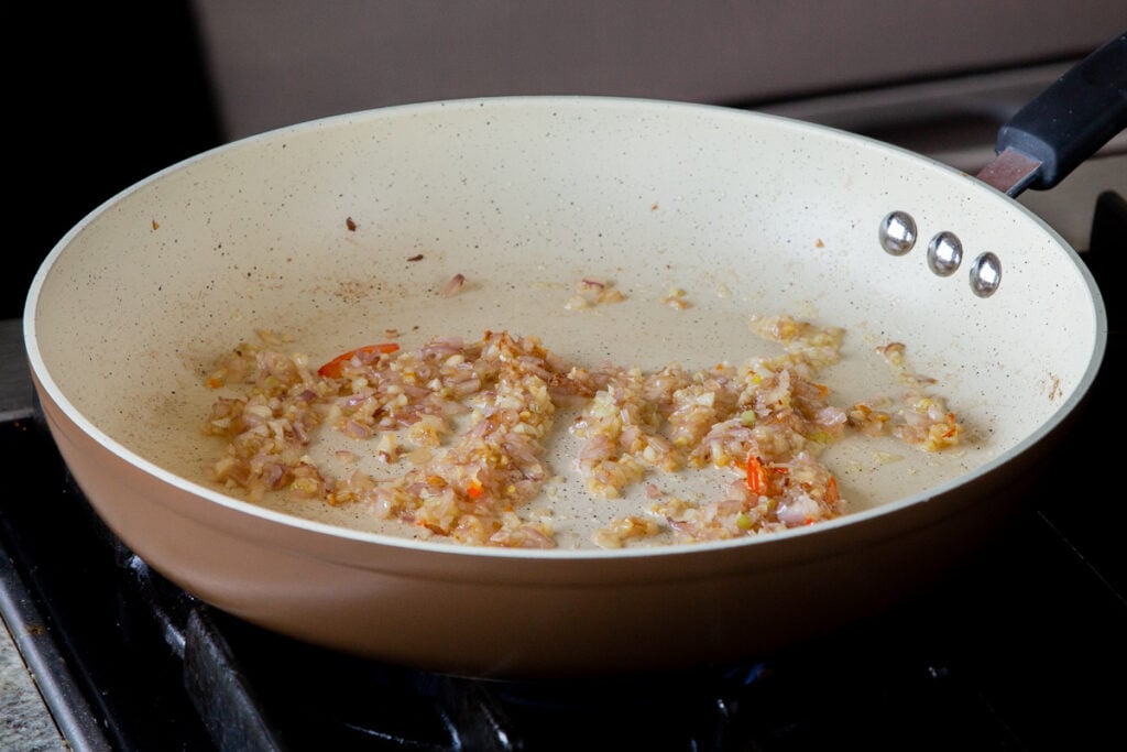 sautéing the garlic and onion, after cooking when they are golden
