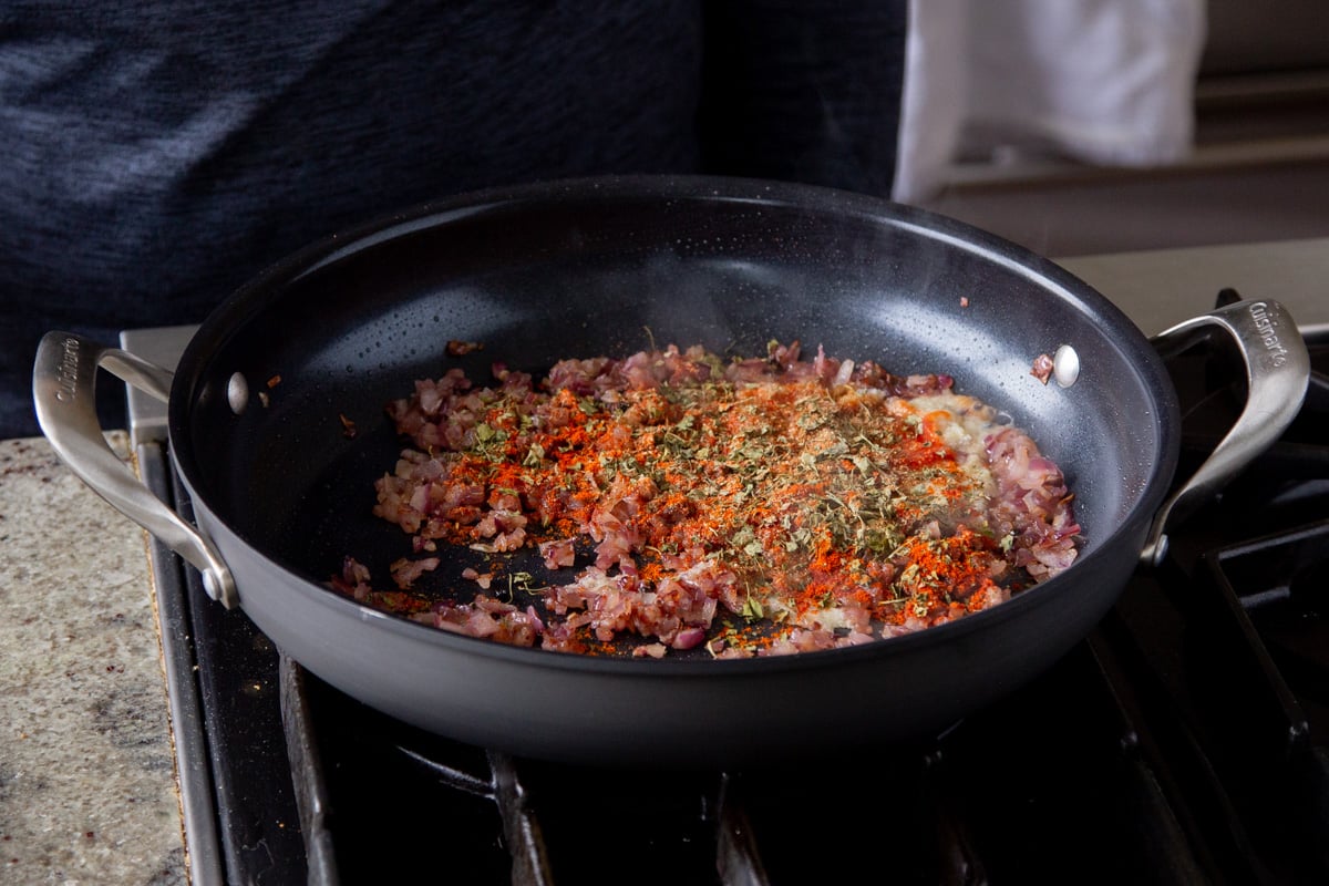 cooked onions in the pan with spices
