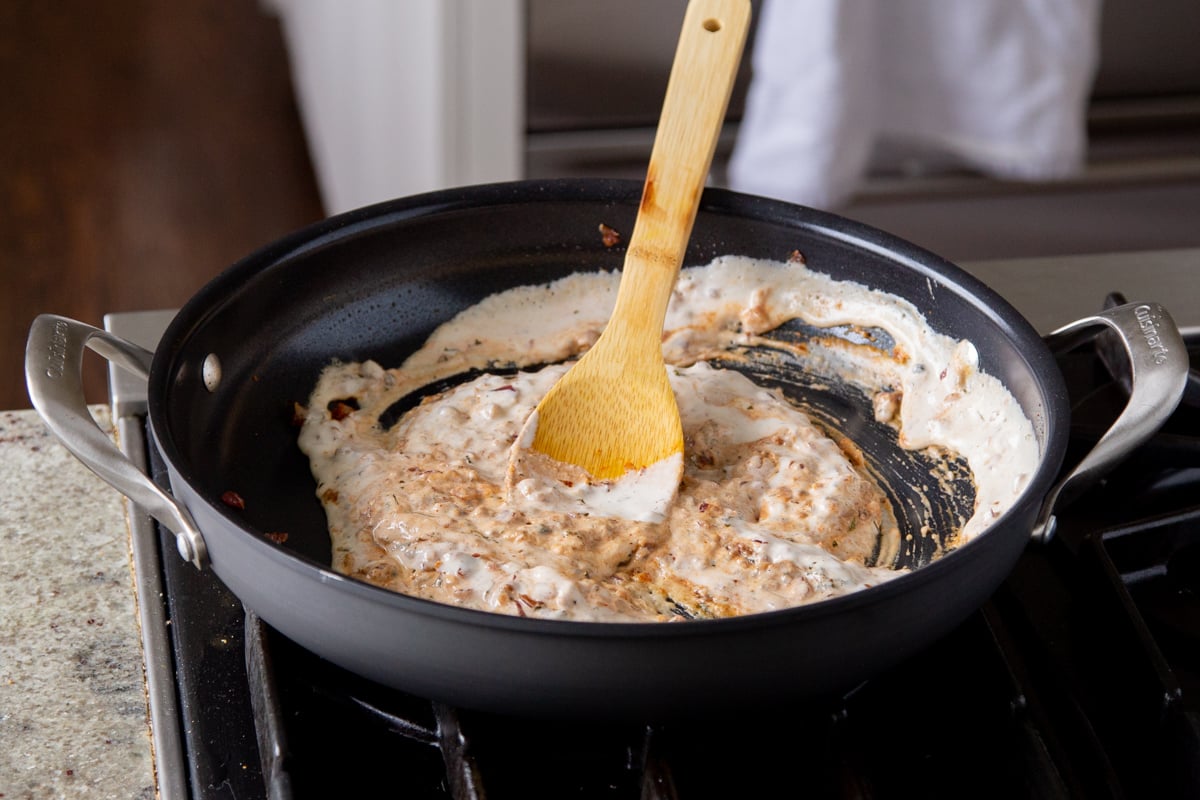 vegan cream in the pan mixed with spices and onions