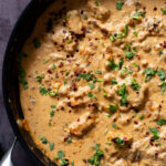 vegan kasuri malai murg in the pan, after cooking with fresh herbs sprinkled on top