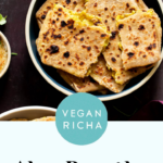aloo paratha pilled up on a plate, text overlay