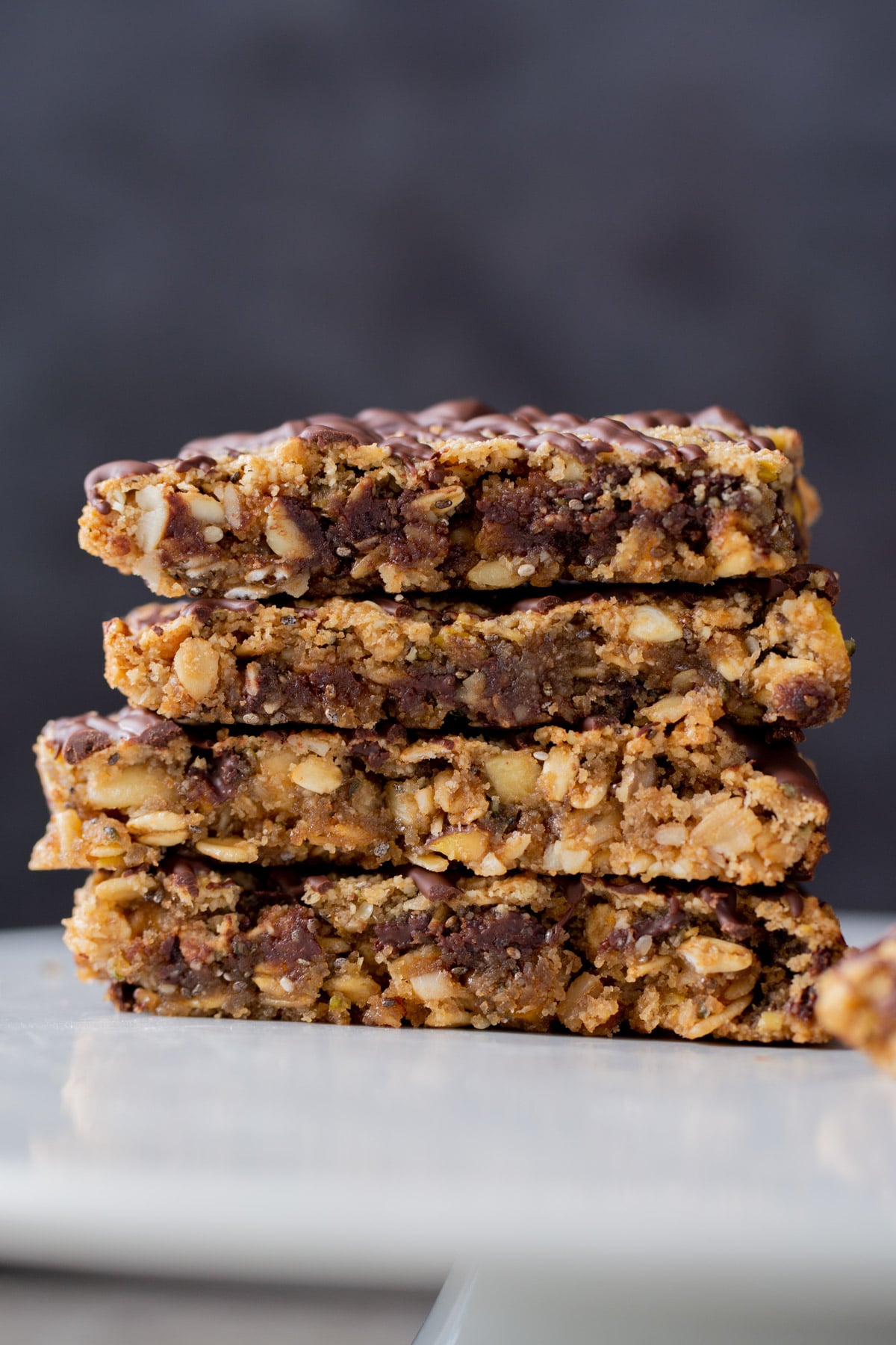 stack of crunchy granola bars, side shot, so you can see the texture inside