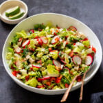 chaat masala salad in the mixing bowl with serving spoons