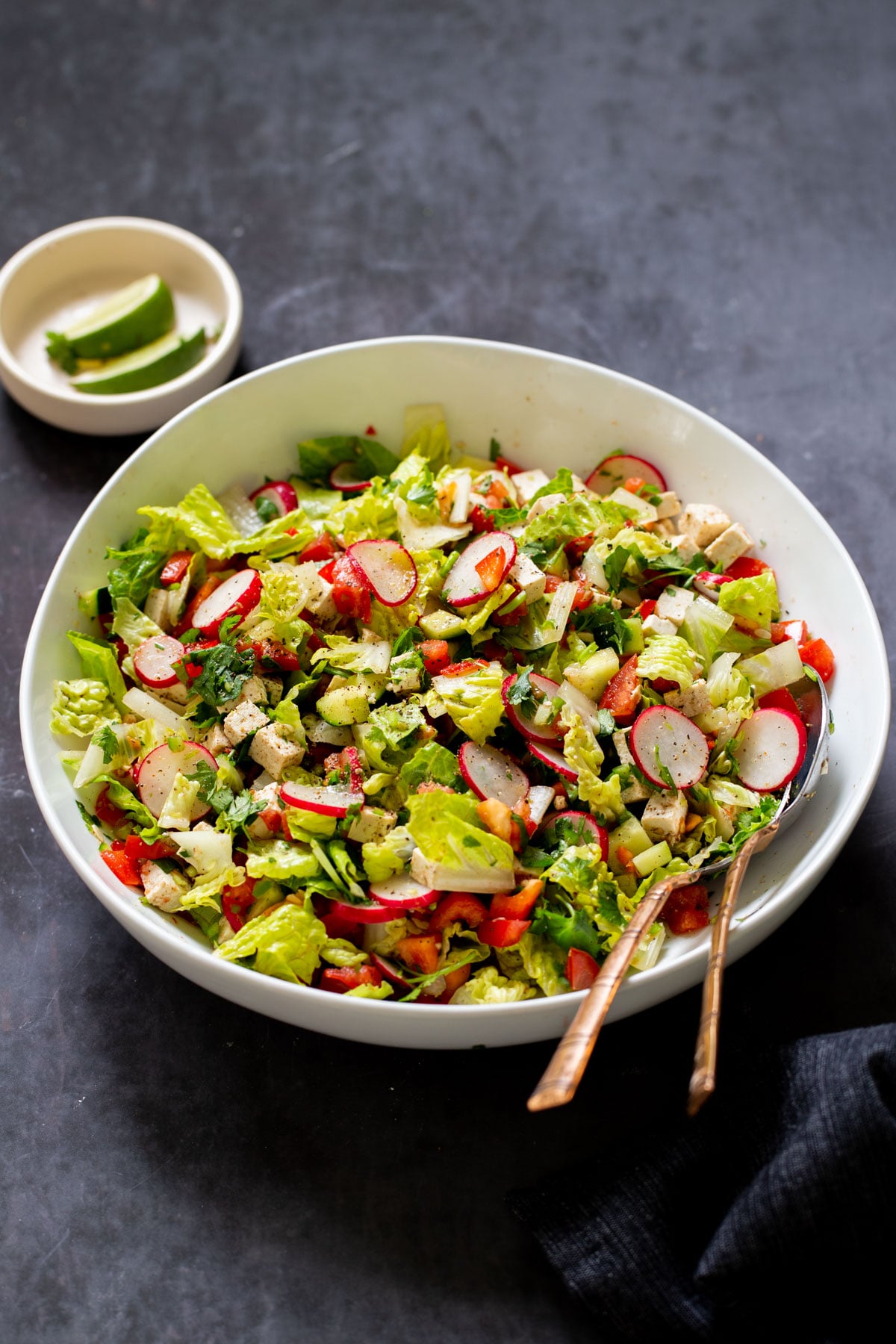 chaat masala salad in the mixing bowl with serving spoons