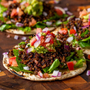 3 crispy quinoa tacos on a serving tray