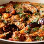 close-up of tofu eggplant curry in th pan with cilantro
