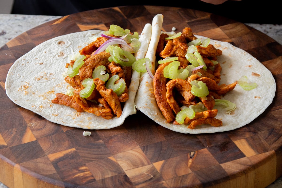 topping the soy curls with celery pieces